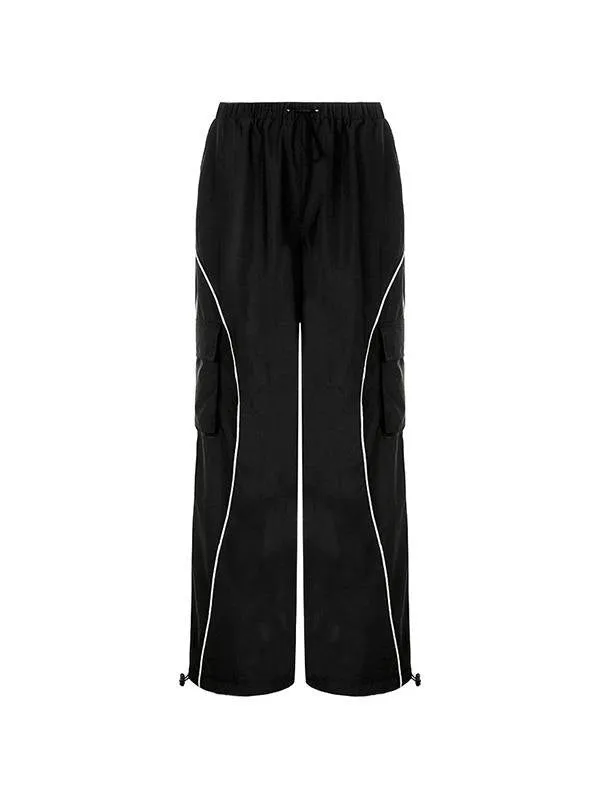 Black parachute trousers with cargo pockets and piping details